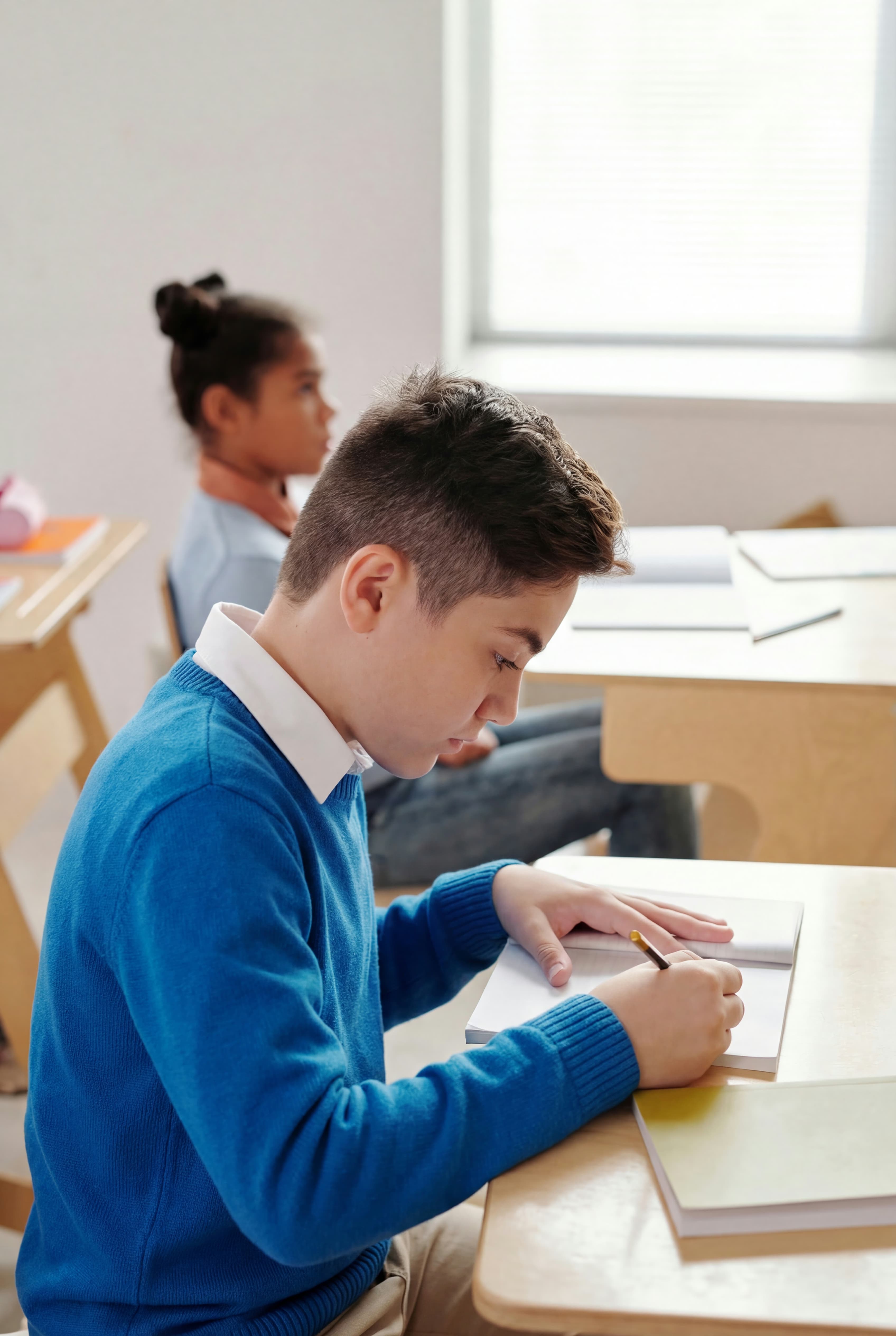 A teacher creating educational materials on their computer