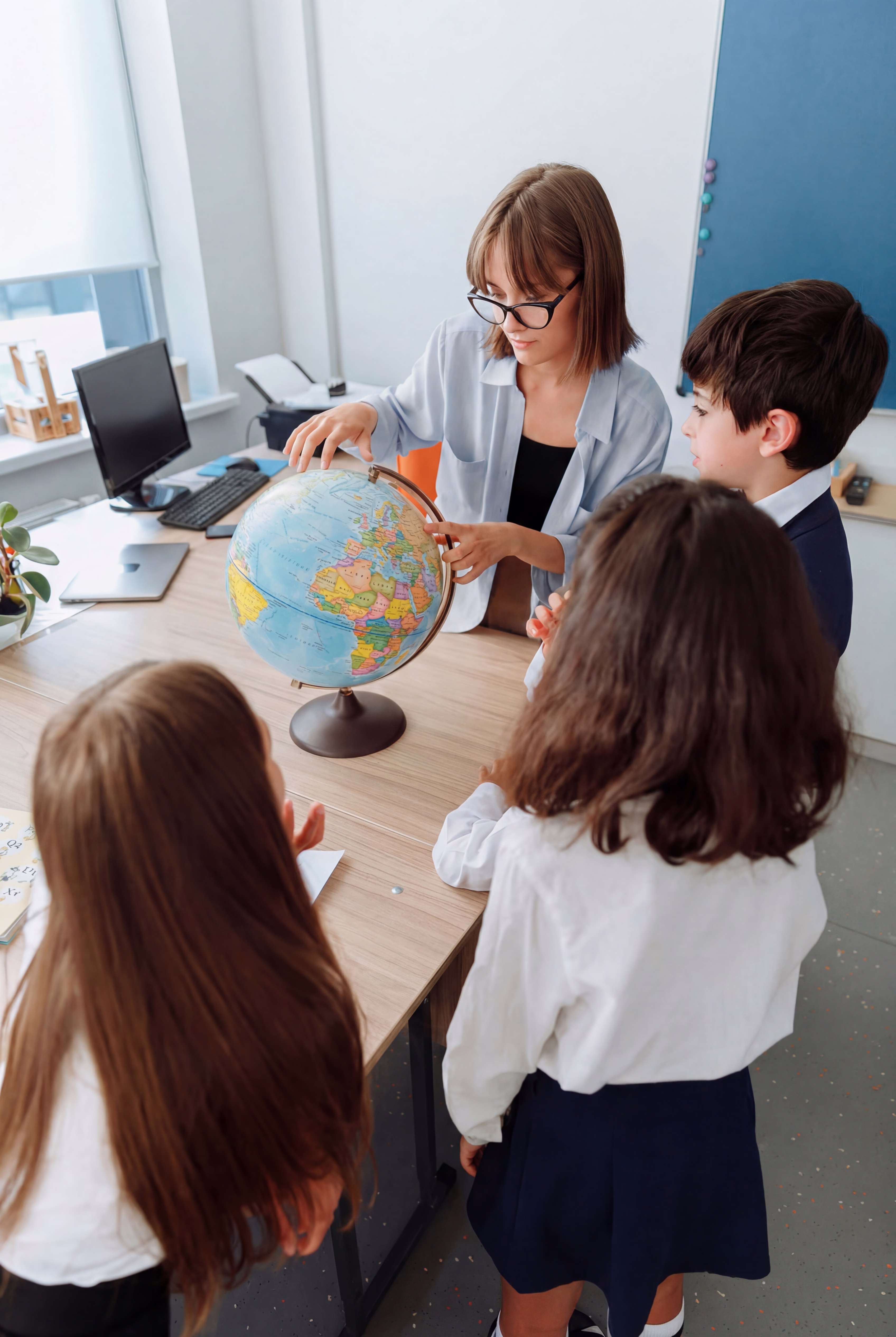 An educator building a curriculum on their computer